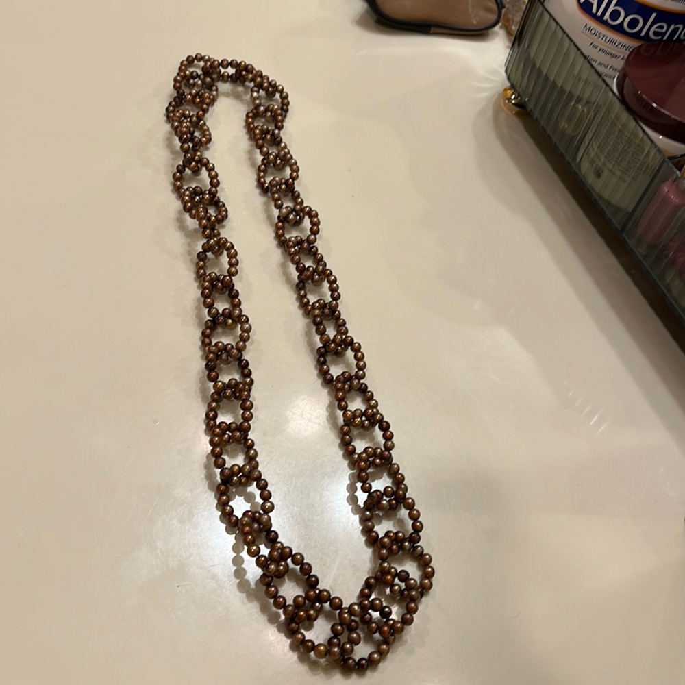 Real pearl necklace. Interlocking loops    Made in Bangkok.  32 inches
